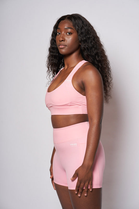 girl in pink hebe shorts and bra top gymwear set