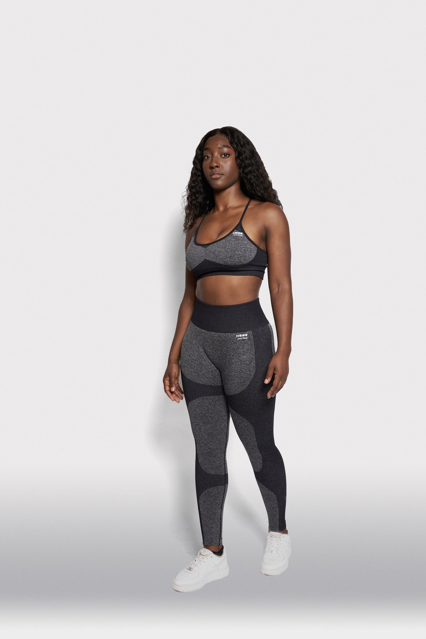 black girl wearing grey gymwear set