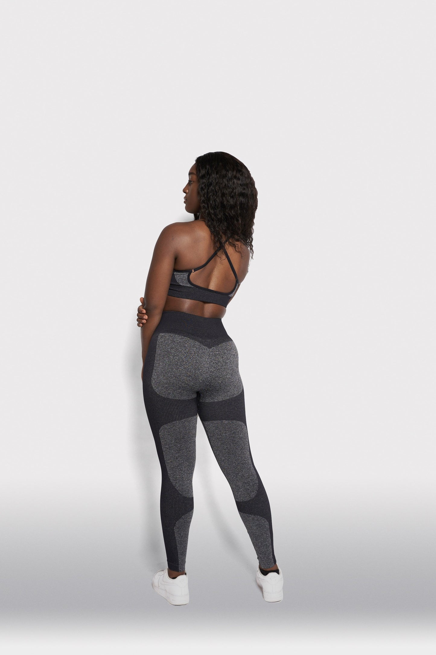 back view of grey bra top and leggings gymwear set